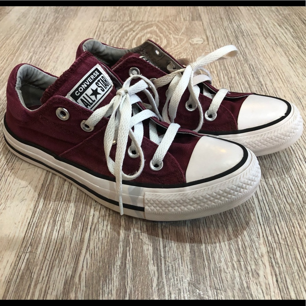 Maroon low top Chuck Taylor’s/Converses